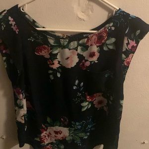 I am selling a shirt with flowers and green leaves